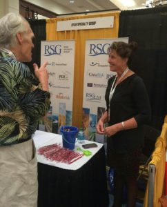 Cindy Hogan networks with a trade show attendee. 